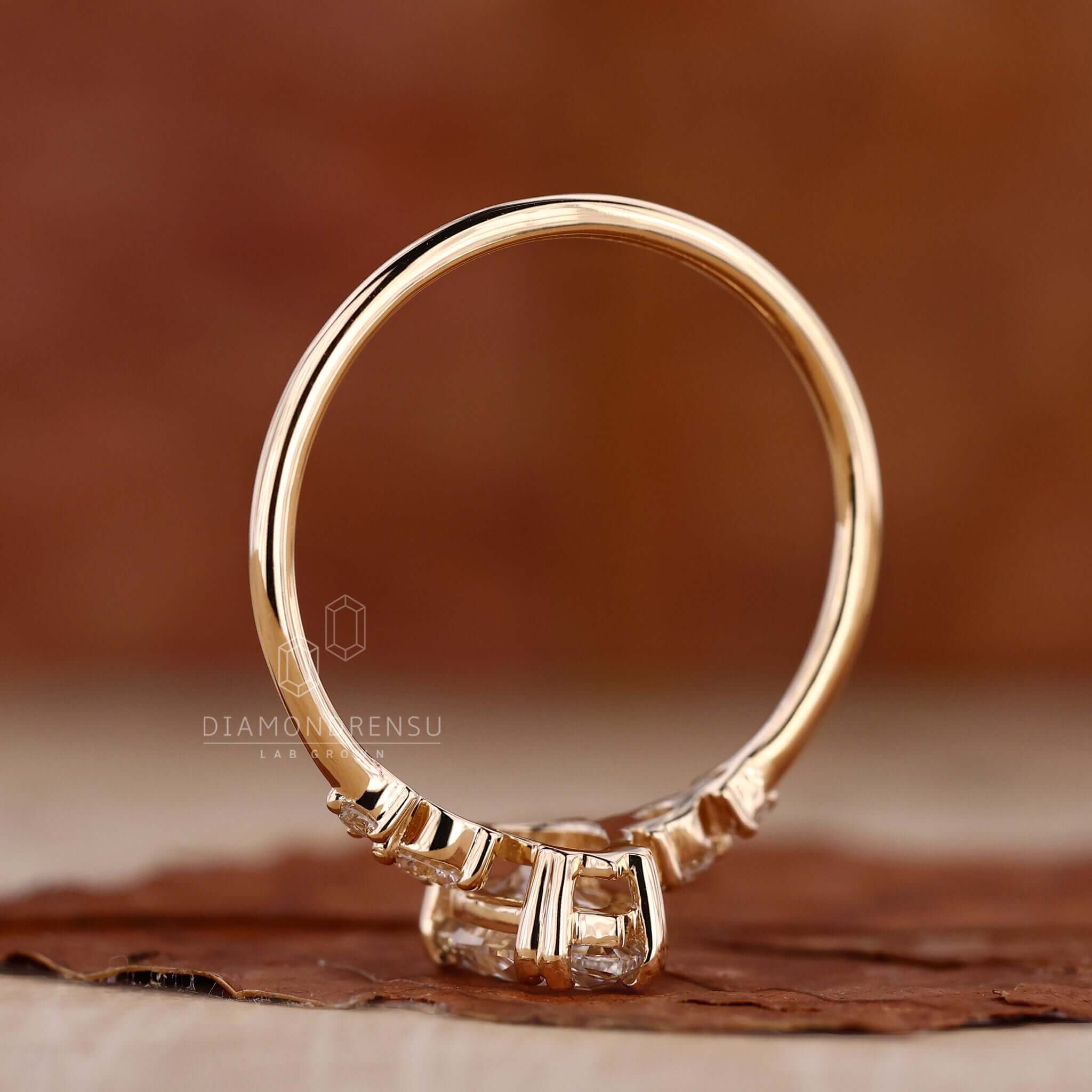 Pear ring crafted in yellow gold with a claw prong engagement ring style for added brilliance.
