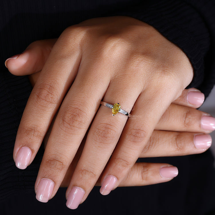 UK engagement ring featuring compass prong setting ring.
