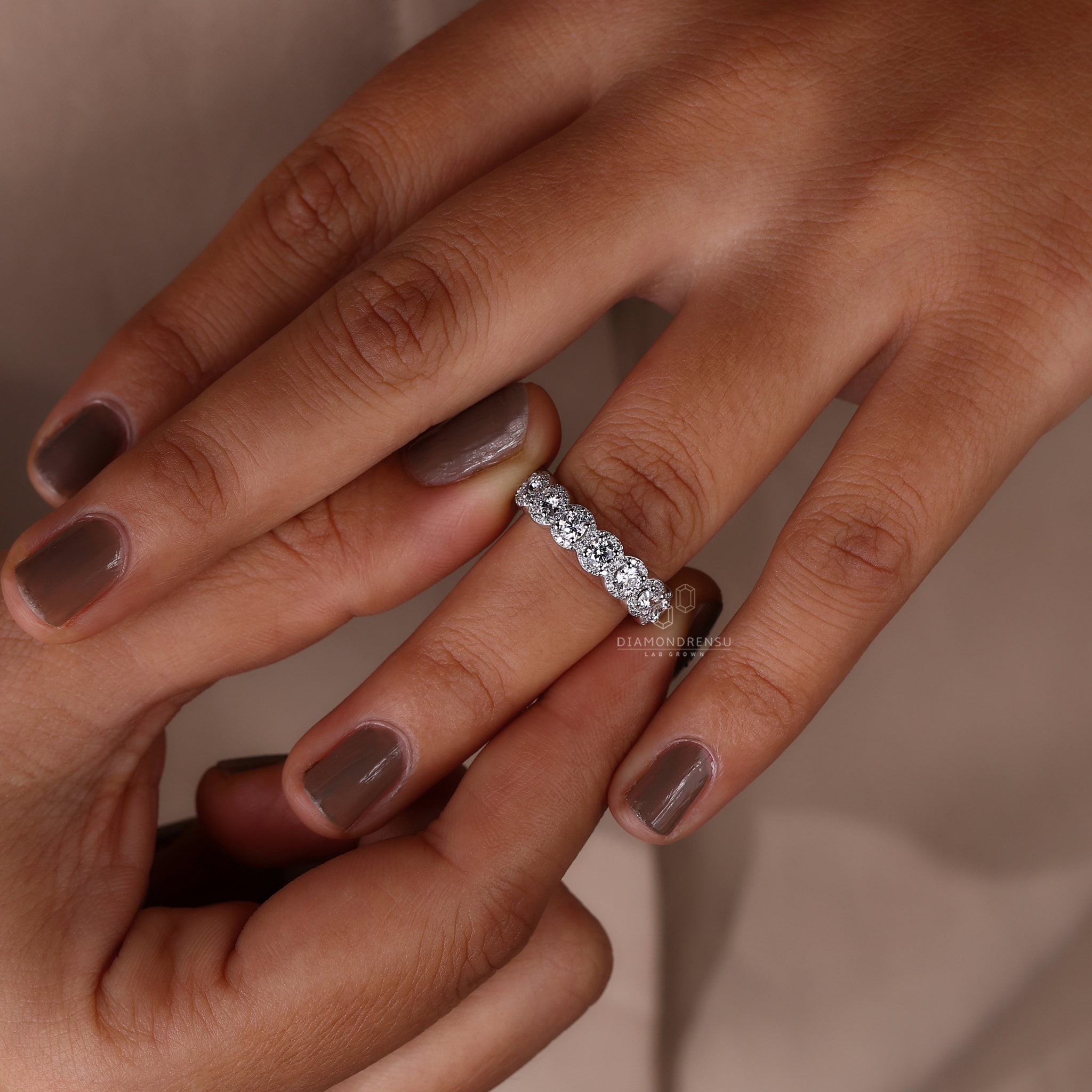 Lab grown diamond halo wedding band with round prong setting
