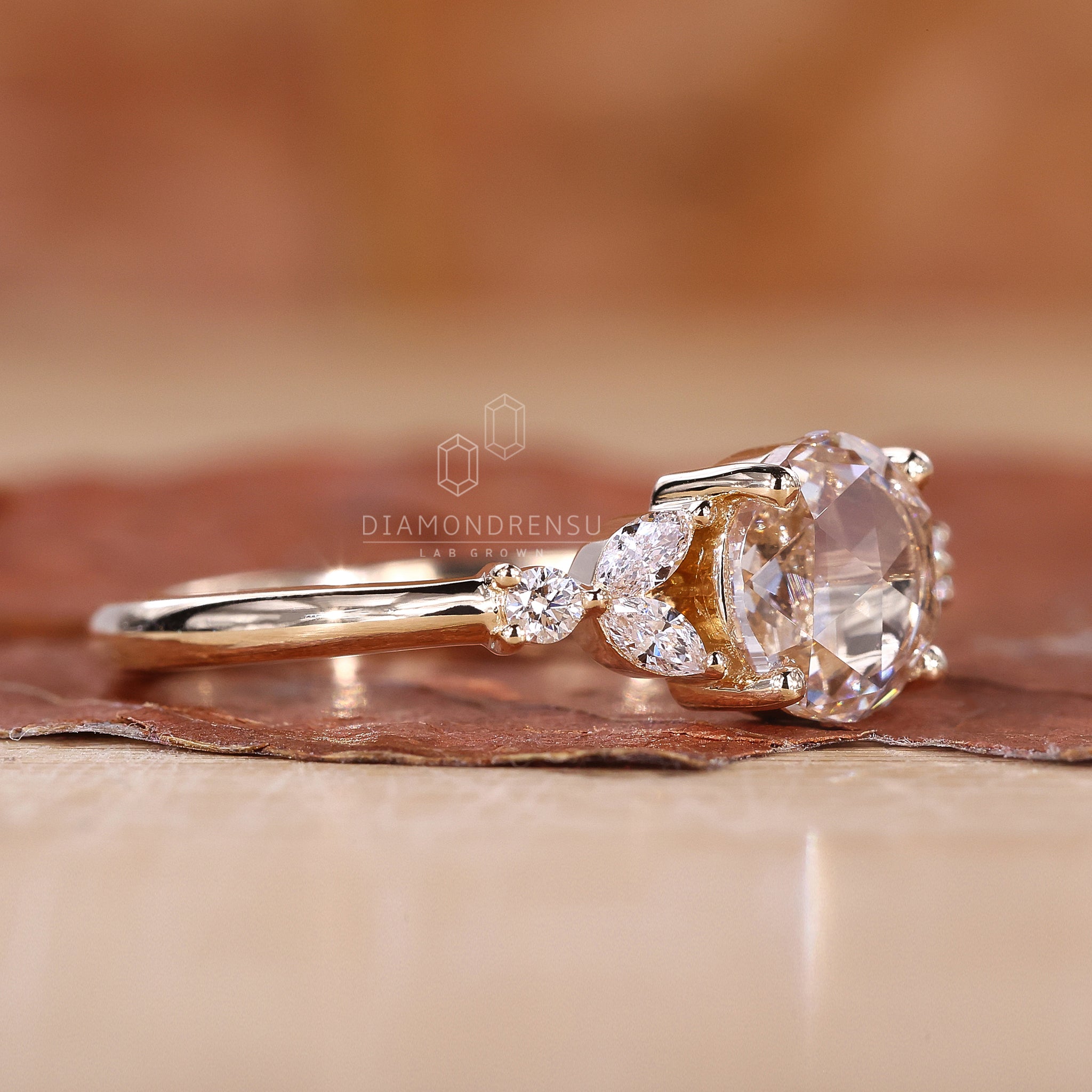 Diamond ring with marquise side stones for added sparkle.