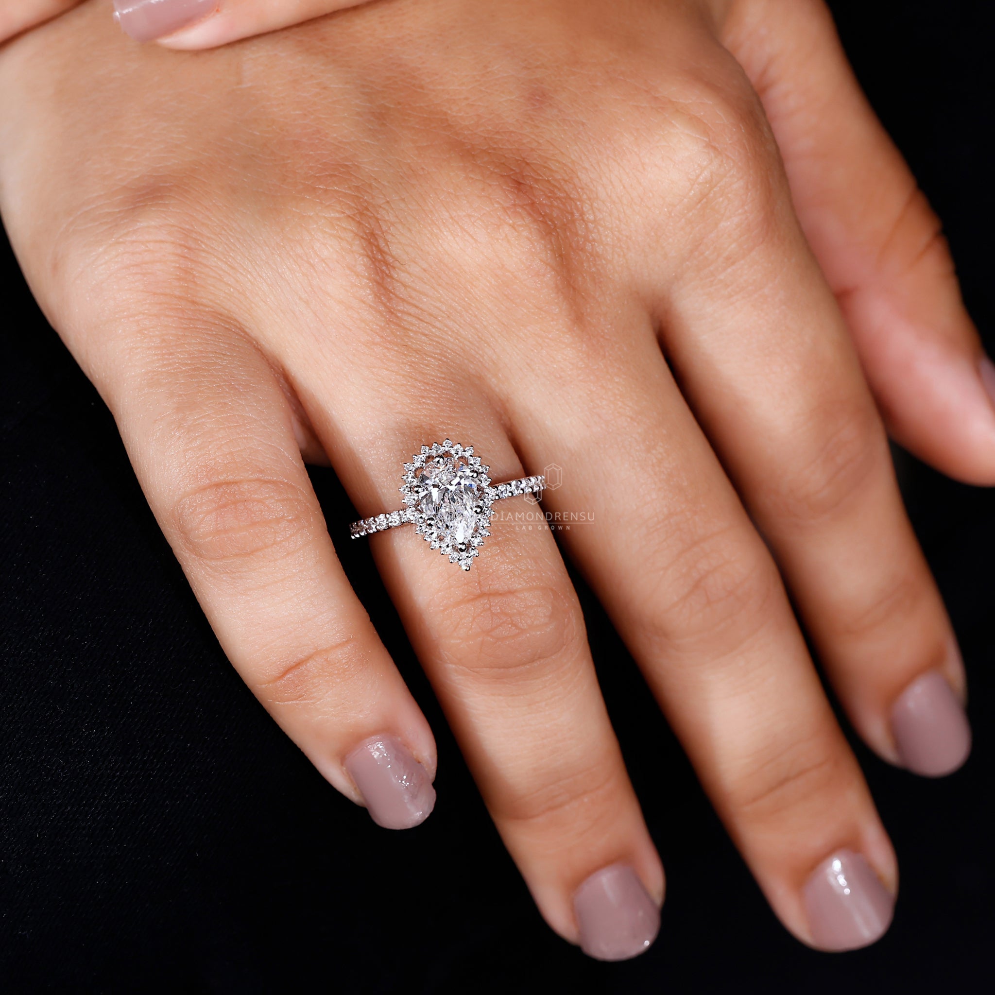 Pave diamond ring with lab grown diamond centrepiece.
