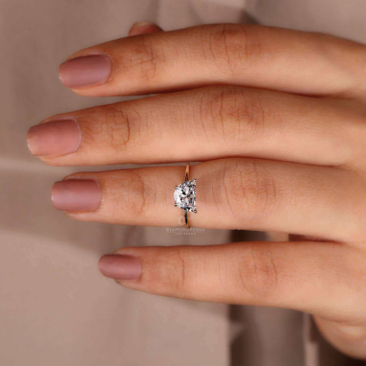 4 prong setting gold ring highlighting the natural beauty of the diamond.