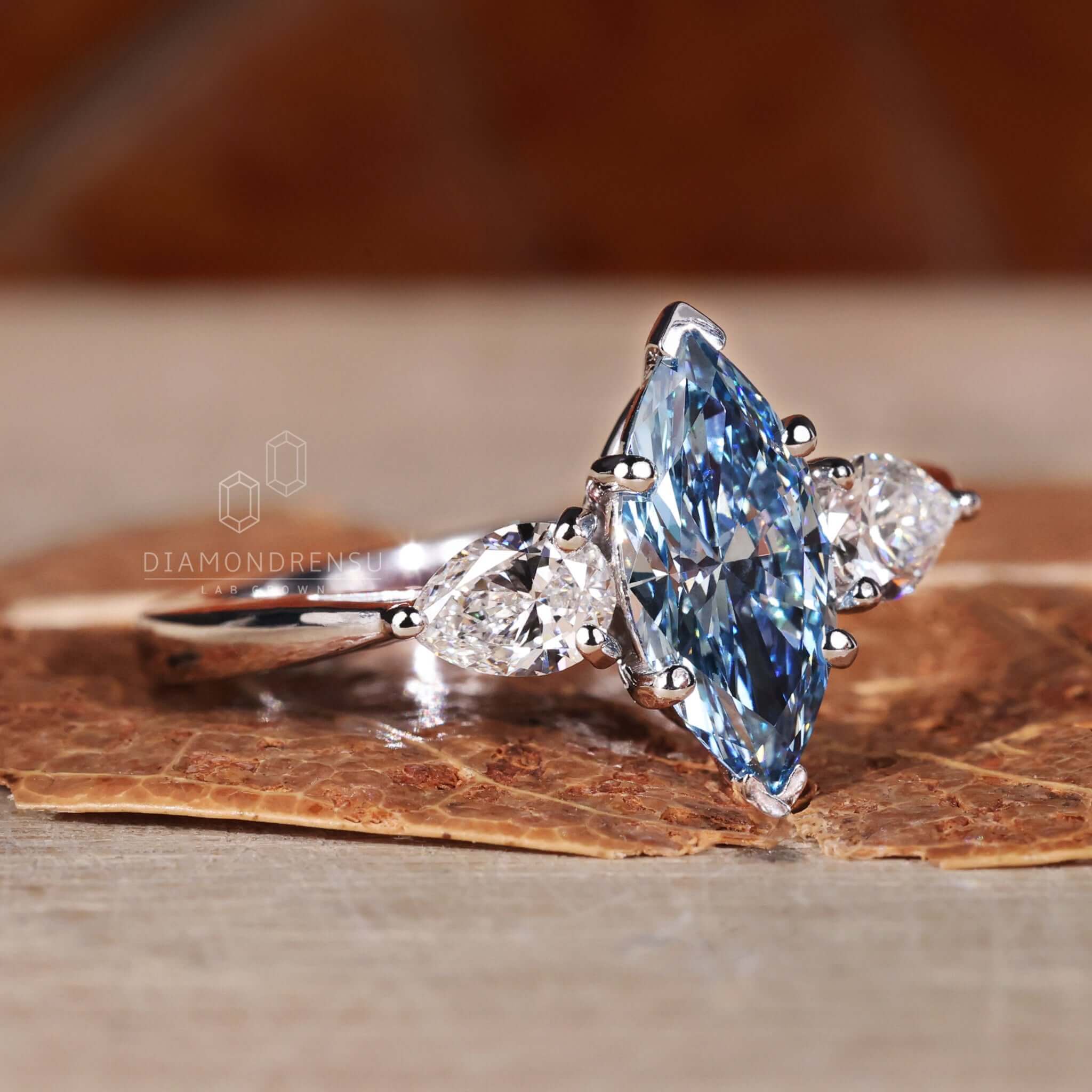 Engagement ring with pear side stones crafted for sophistication.