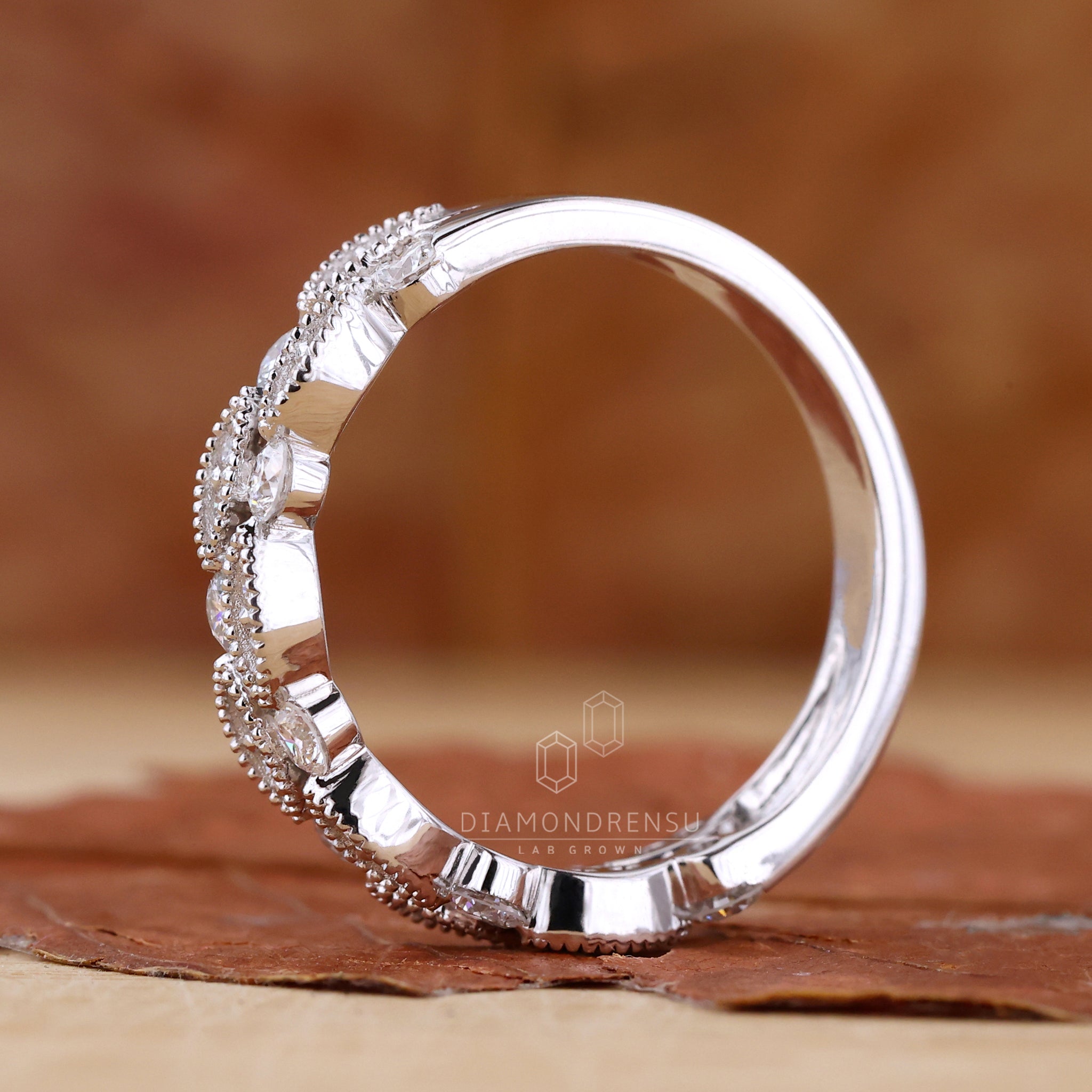 UK wedding band with lab grown diamonds in prong setting
