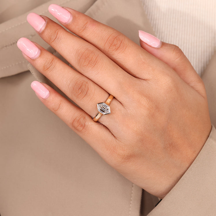 Solitaire ring featuring a hexagon lab grown diamond.
