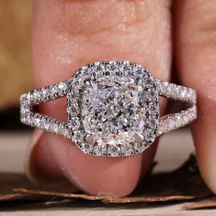 Cushion cut diamond ring with a stunning pave setting design.

