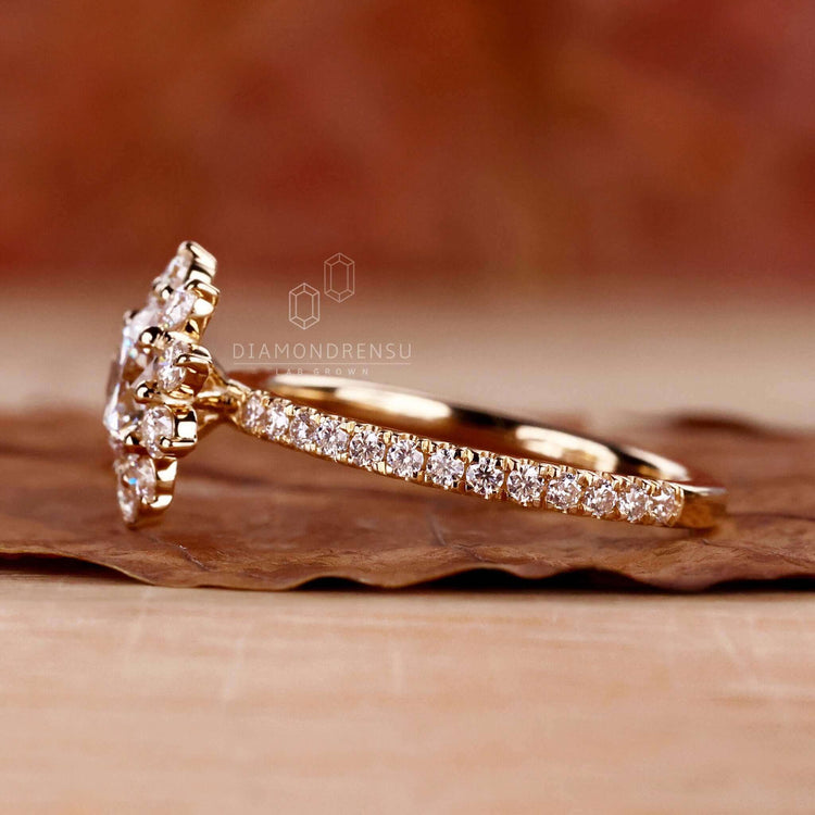 Elegant diamond cluster ring with intricate handmade details.