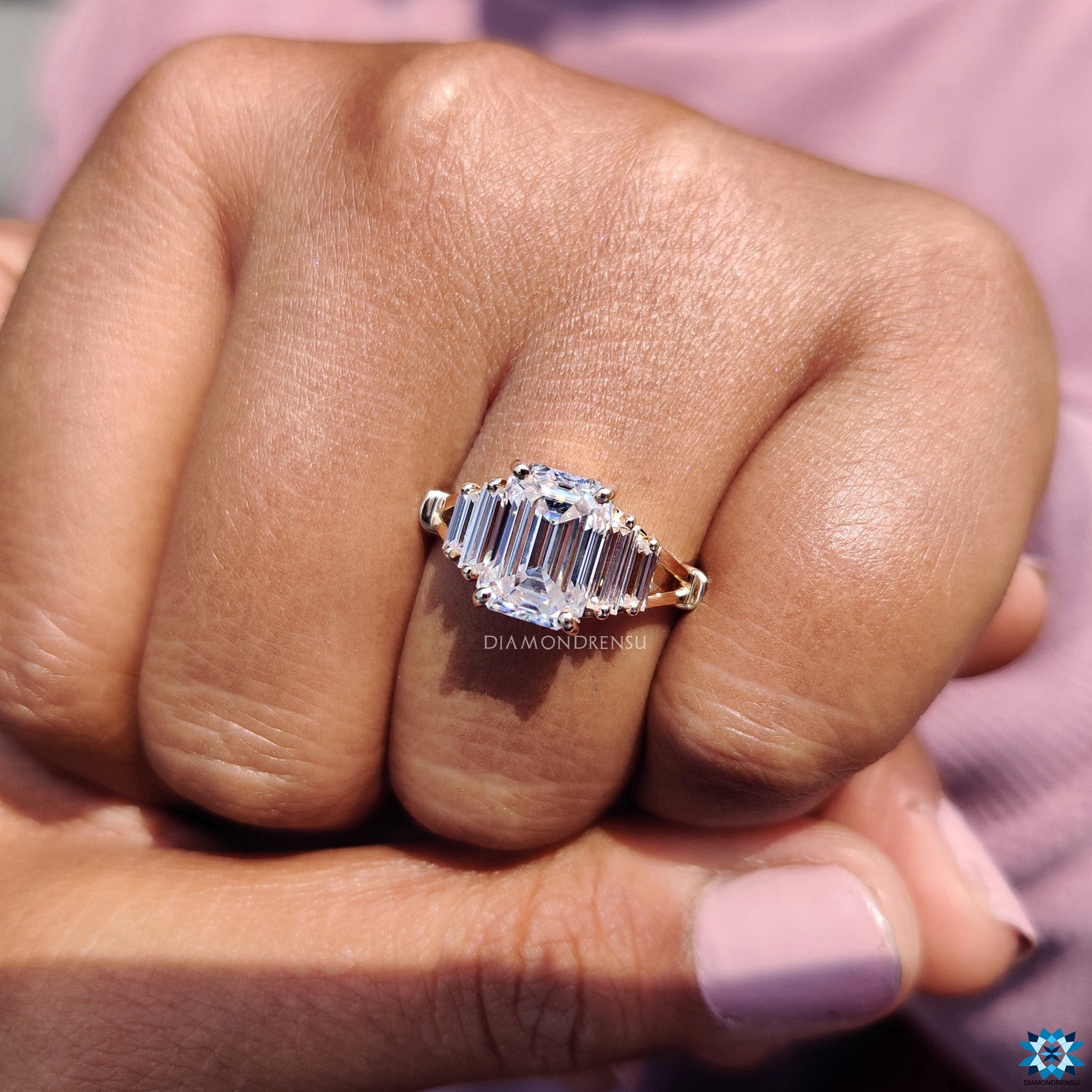 Custom engagement ring with baguette side stones and split shank.
