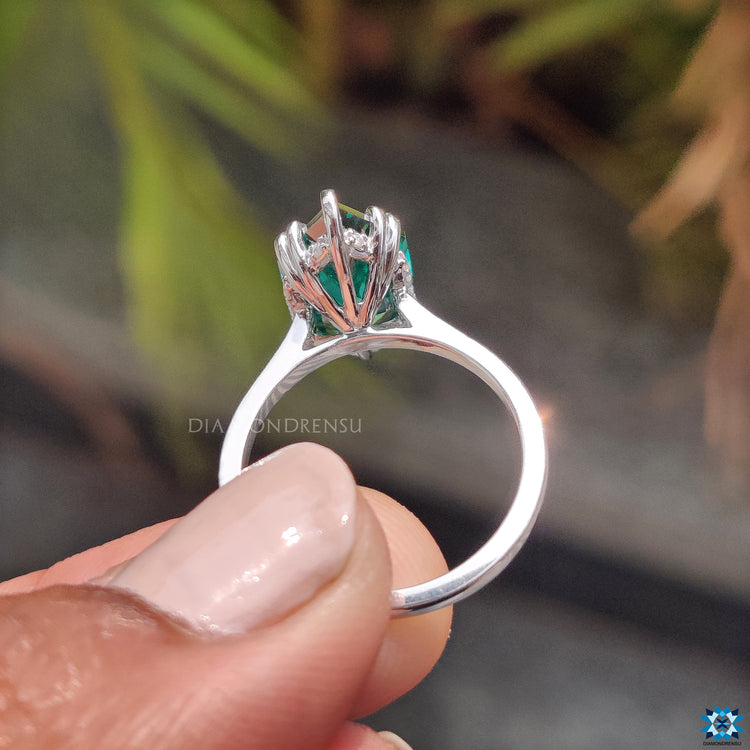 Custom engagement ring featuring Dutch marquise moissanite in solitaire style.
