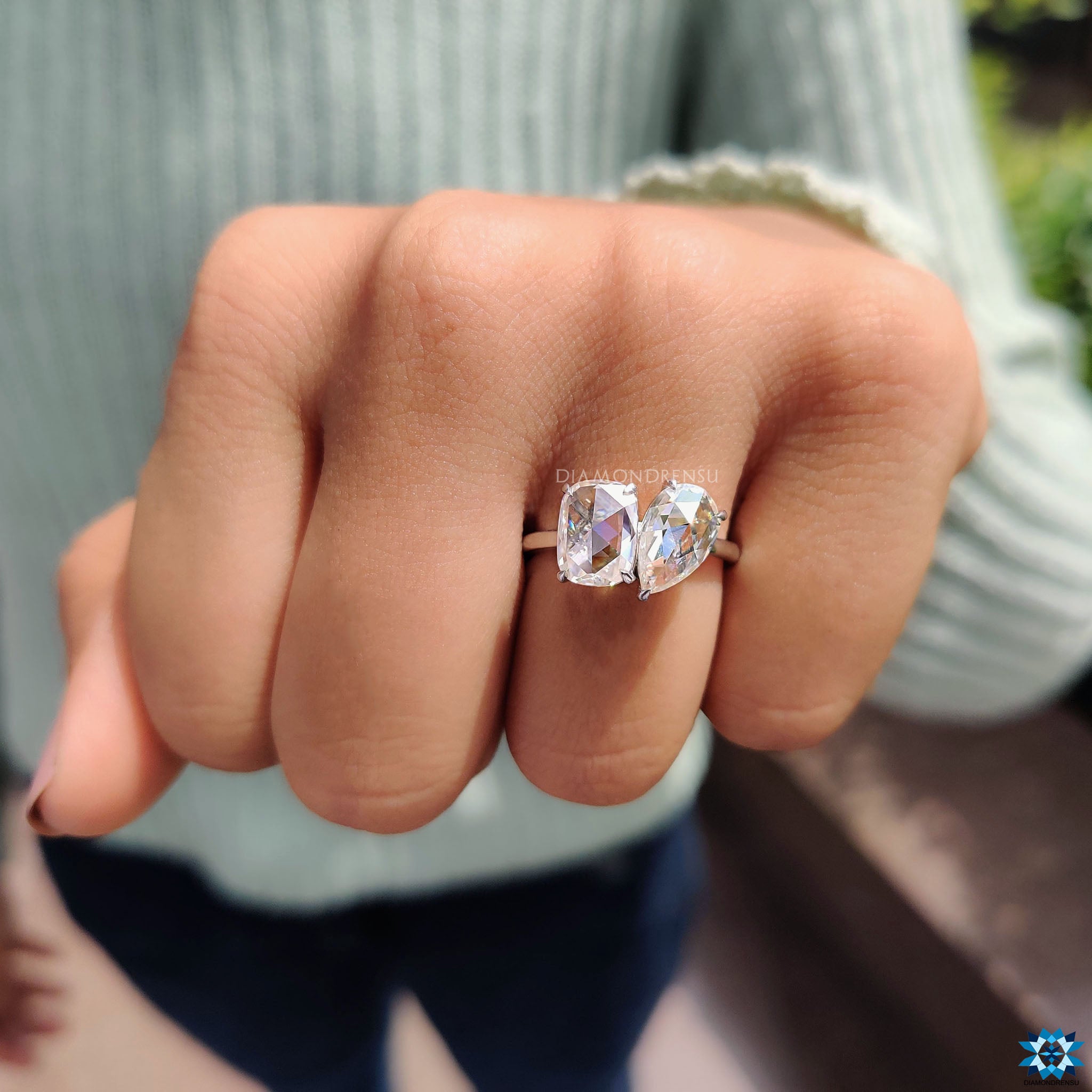 Custom rose cut moissanite ring with pear and cushion stones.

