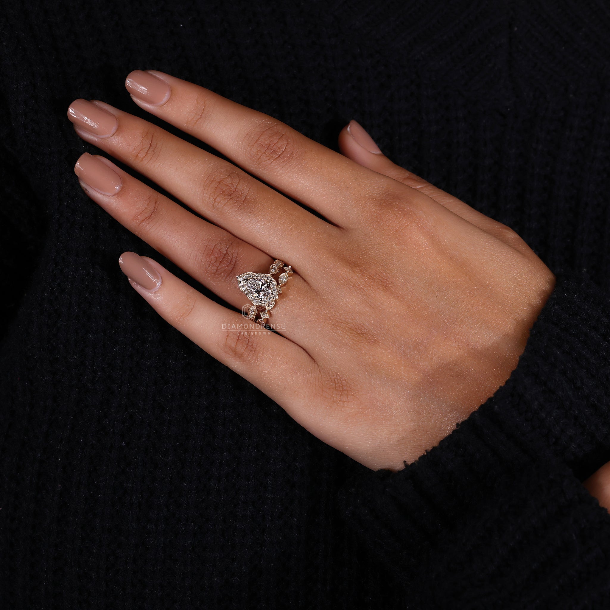 Marquise shape outline band with pear diamond ring in IGI certified style.
