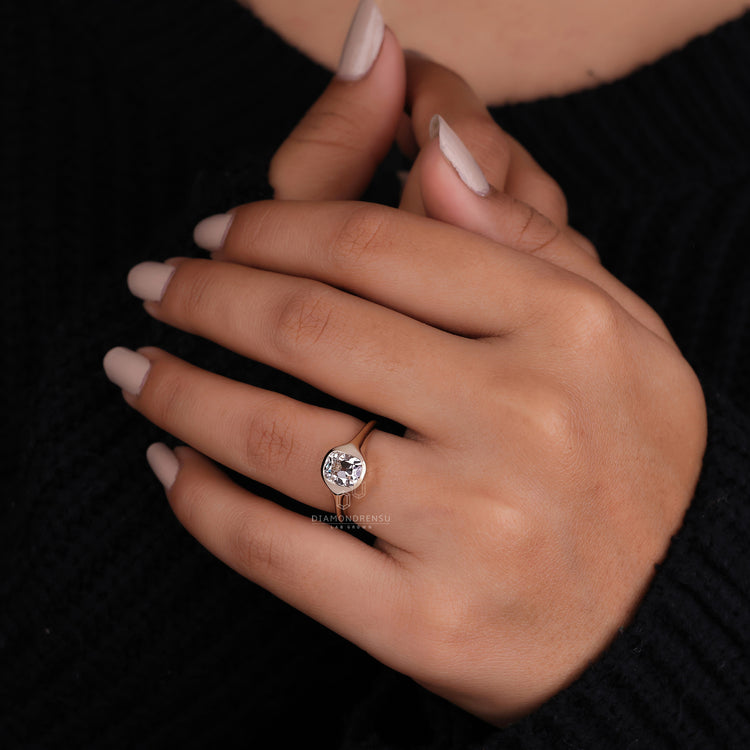 Solitaire engagement ring styled with bezel set engagement ring.

