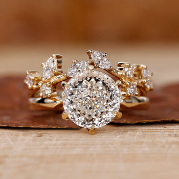 Solitaire engagement ring with wedding band in a yellow gold bridal set.
