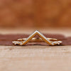 V-shaped wedding ring in yellow gold.
