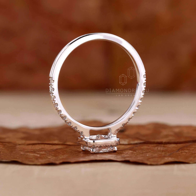 Princess cut diamond engagement ring featuring a sparkling centre stone.