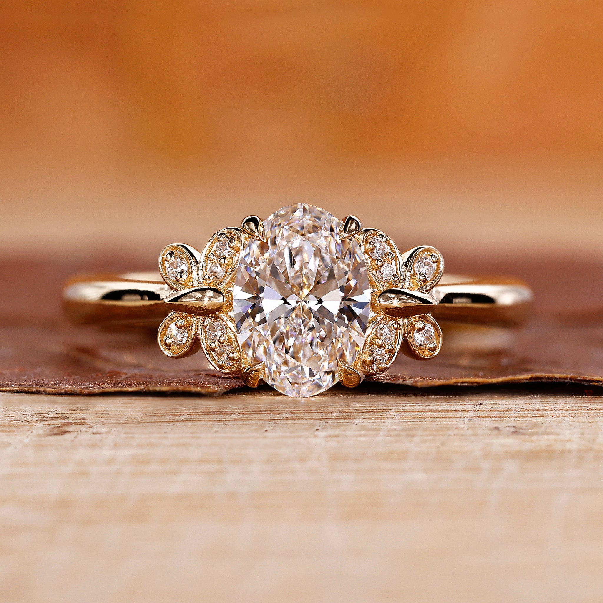 Oval Diamond Engagement Ring is designed with yellow gold ring.
