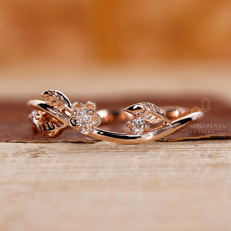 Rose gold diamond band featuring prong set round cut stones.