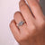 Bridge accent engagement ring with sparkling stones.
