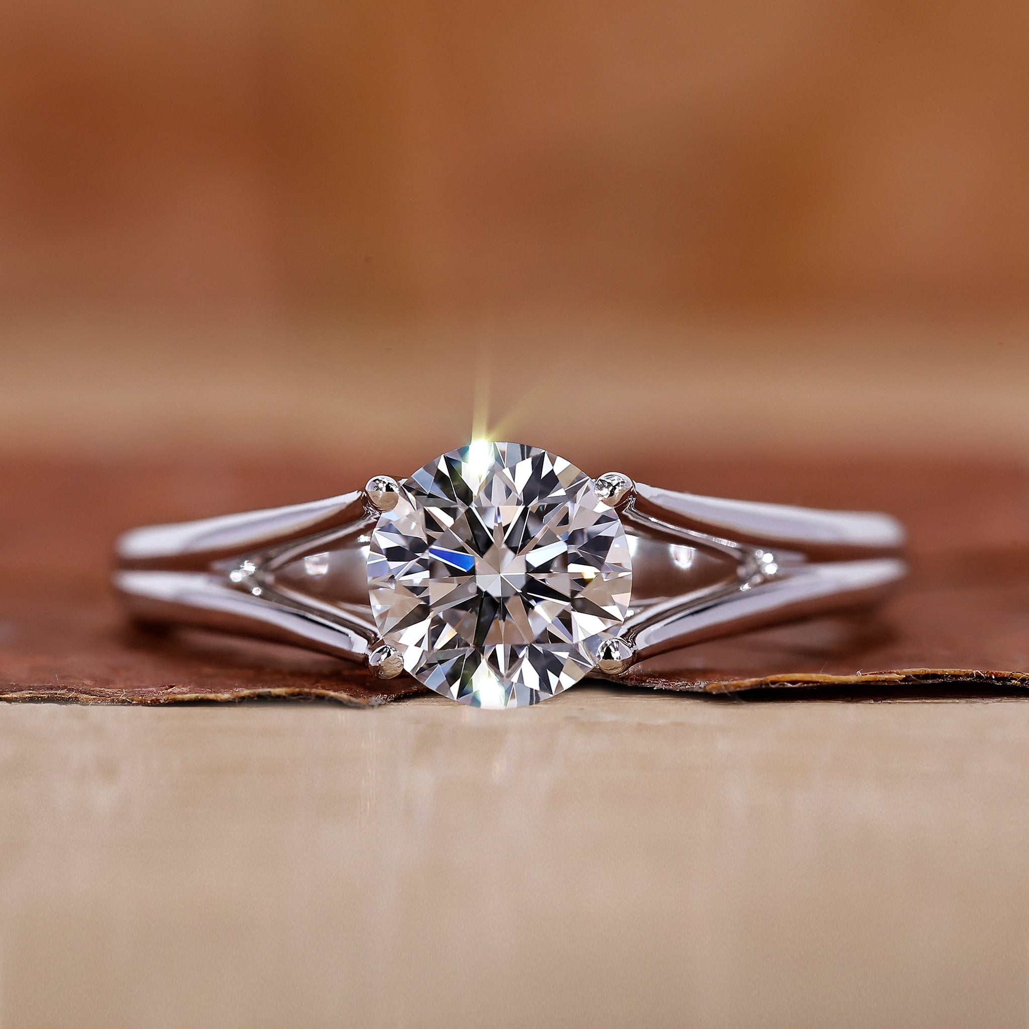 Round solitaire engagement ring has a 4 prong setting.
