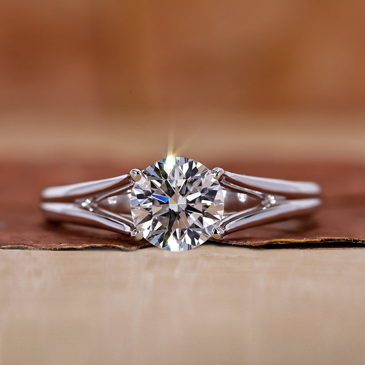 Round solitaire engagement ring has a 4 prong setting.
