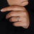 Elegant half halo style ring with round center.
