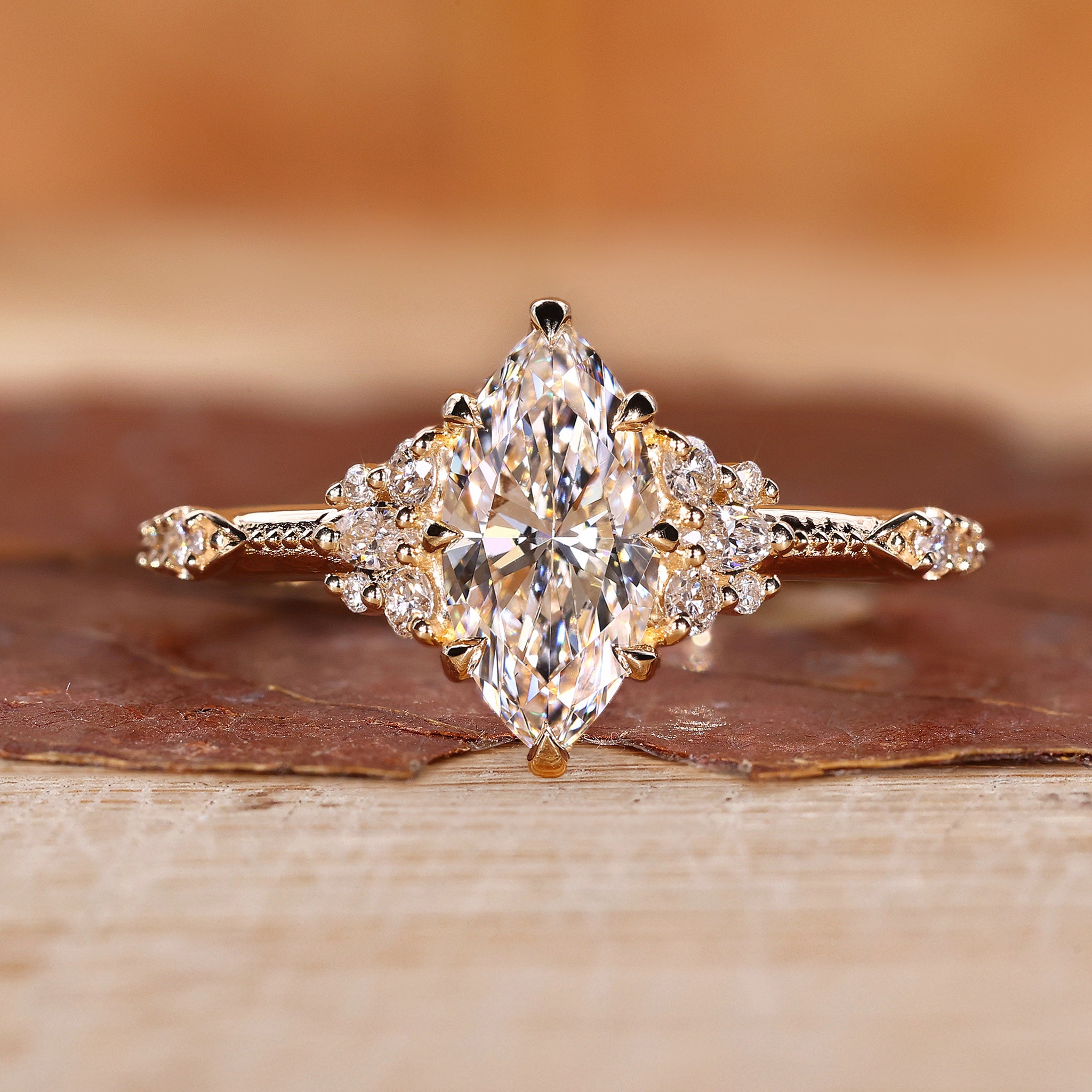 Marquise cluster diamond ring in yellow gold for UK engagement ring.
