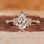 Marquise cluster diamond ring in yellow gold for UK engagement ring.
