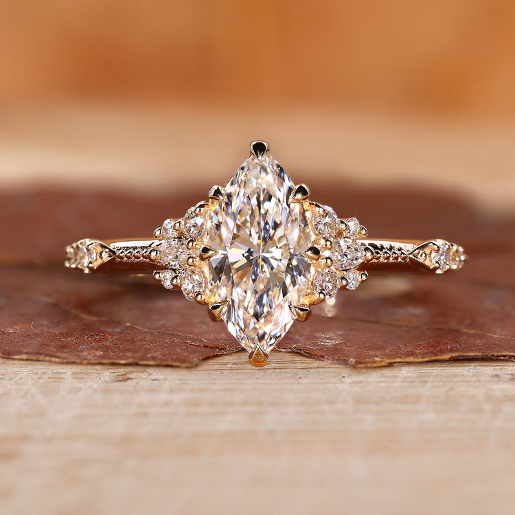 Marquise cluster diamond ring in yellow gold for UK engagement ring.
