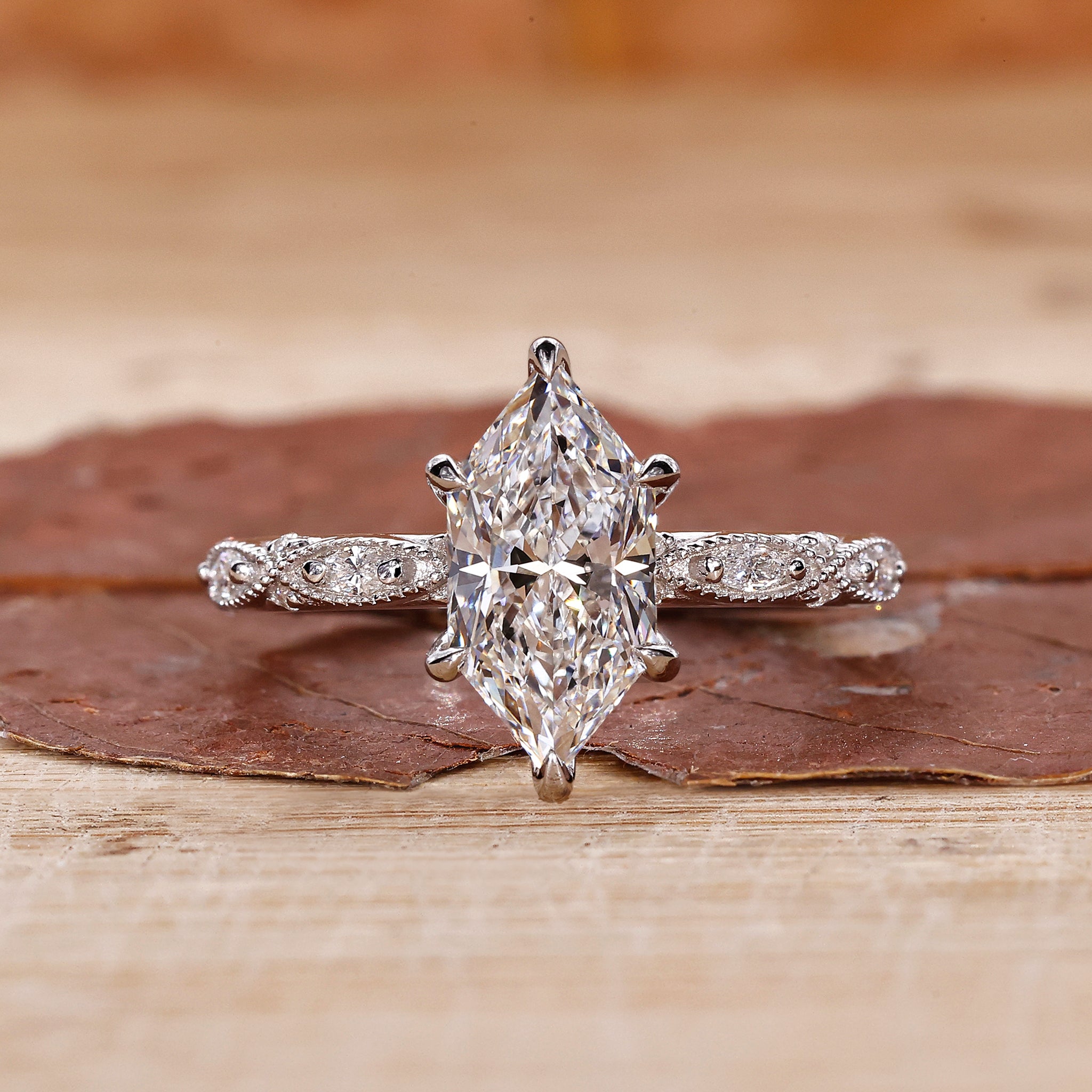 Dutch marquise diamond ring with marquise and round side stones.
