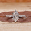 Dutch marquise diamond ring with marquise and round side stones.

