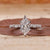Dutch marquise diamond ring with marquise and round side stones.

