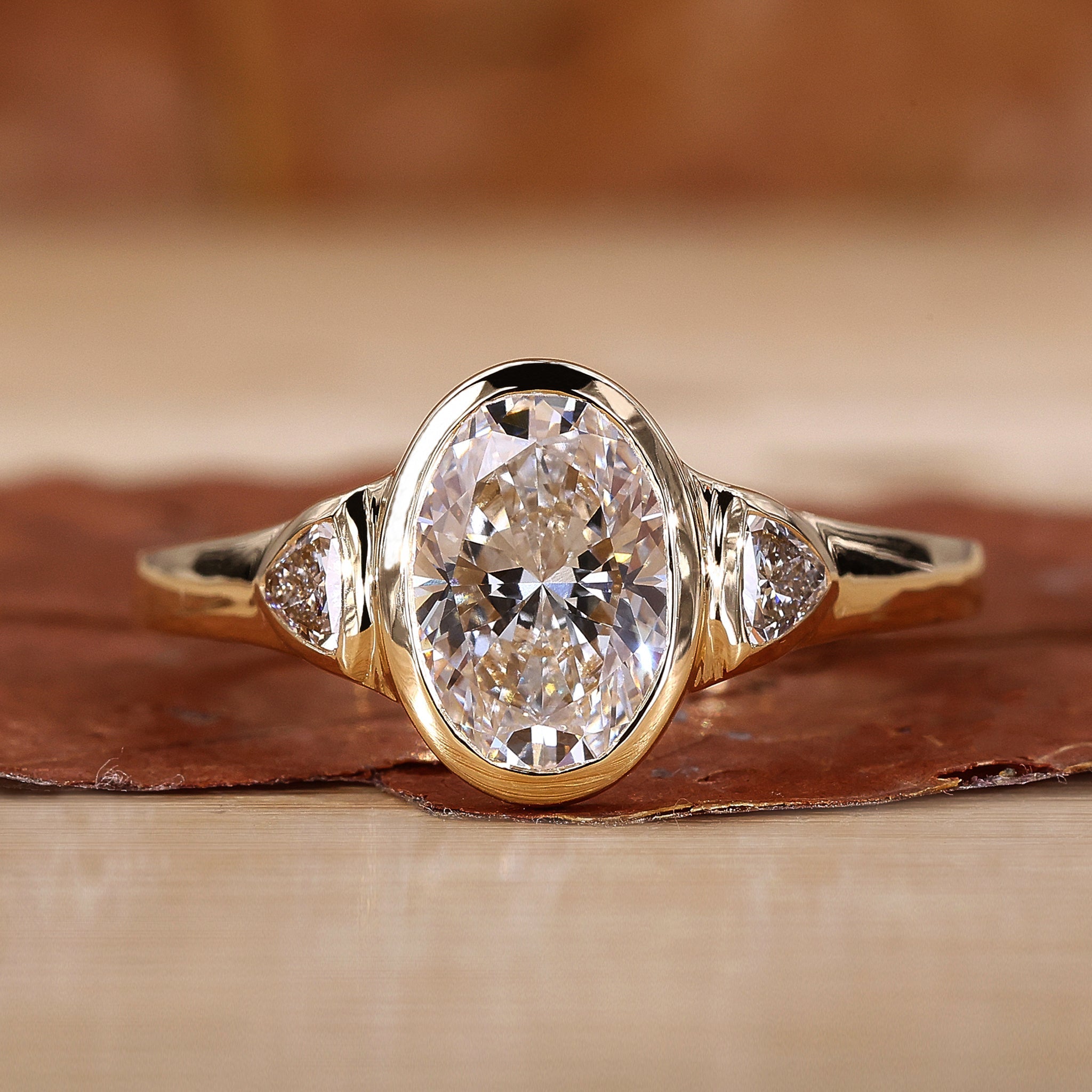 Three Stone Oval Engagement Ring featuring stunning diamonds and a unique design.