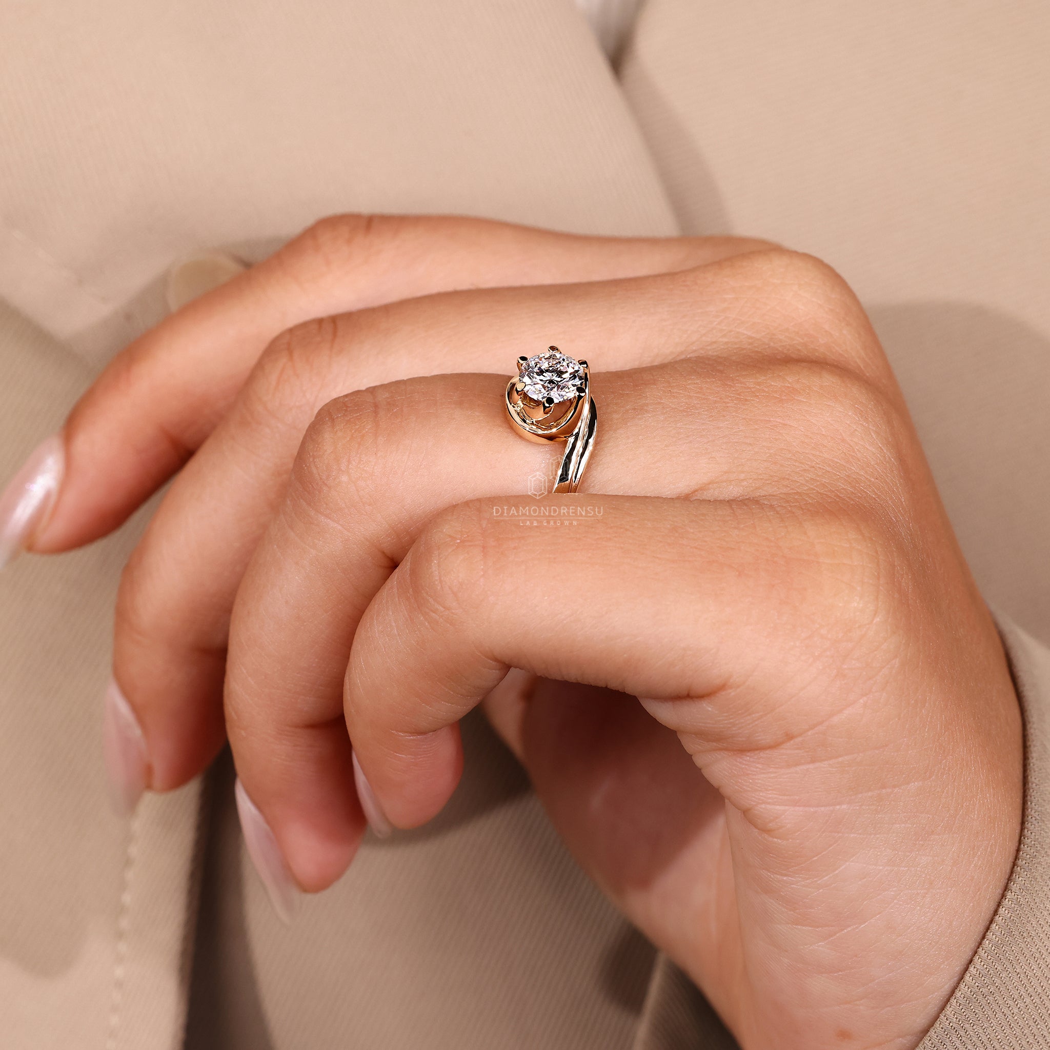 Handmade solitaire ring with six prongs and round diamond.
