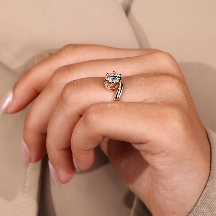 Handmade solitaire ring with six prongs and round diamond.
