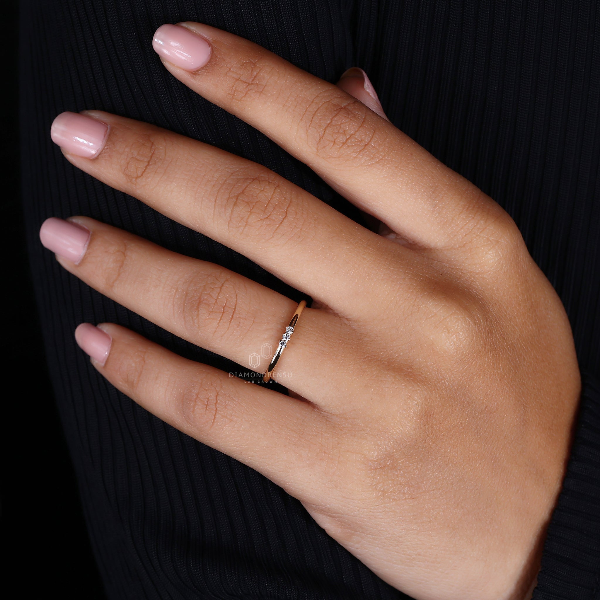 Elegant round cut three stone ring.
