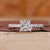 Princess cut diamond engagement ring with pave setting.
