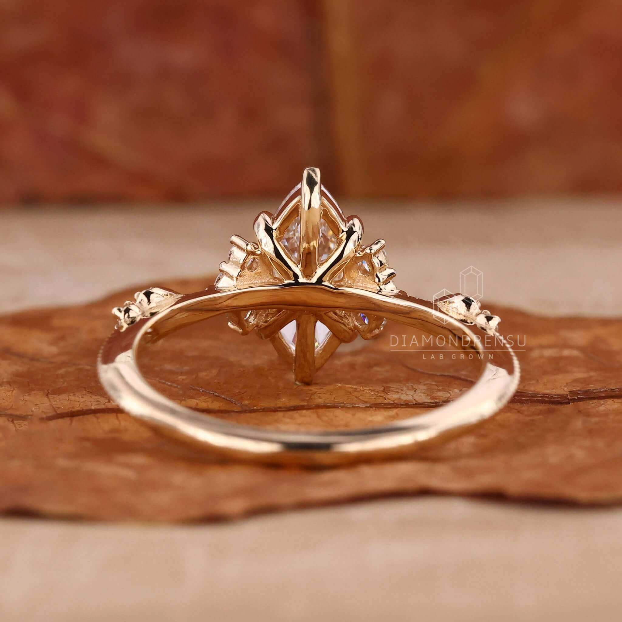 Unique marquise cut engagement ring with handmade detail.