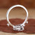 Pear shaped engagement ring with stunning round side stones.