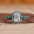 Radiant engagement ring with a halo pavé setting.
