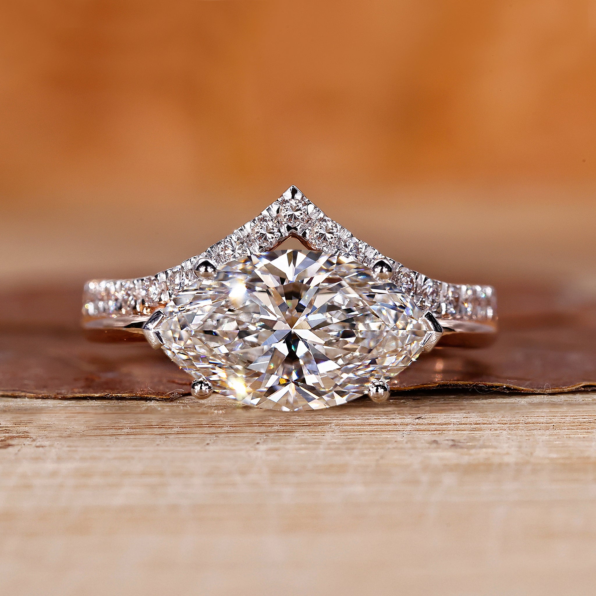 V shaped ring with marquise diamond and hidden halo design.
