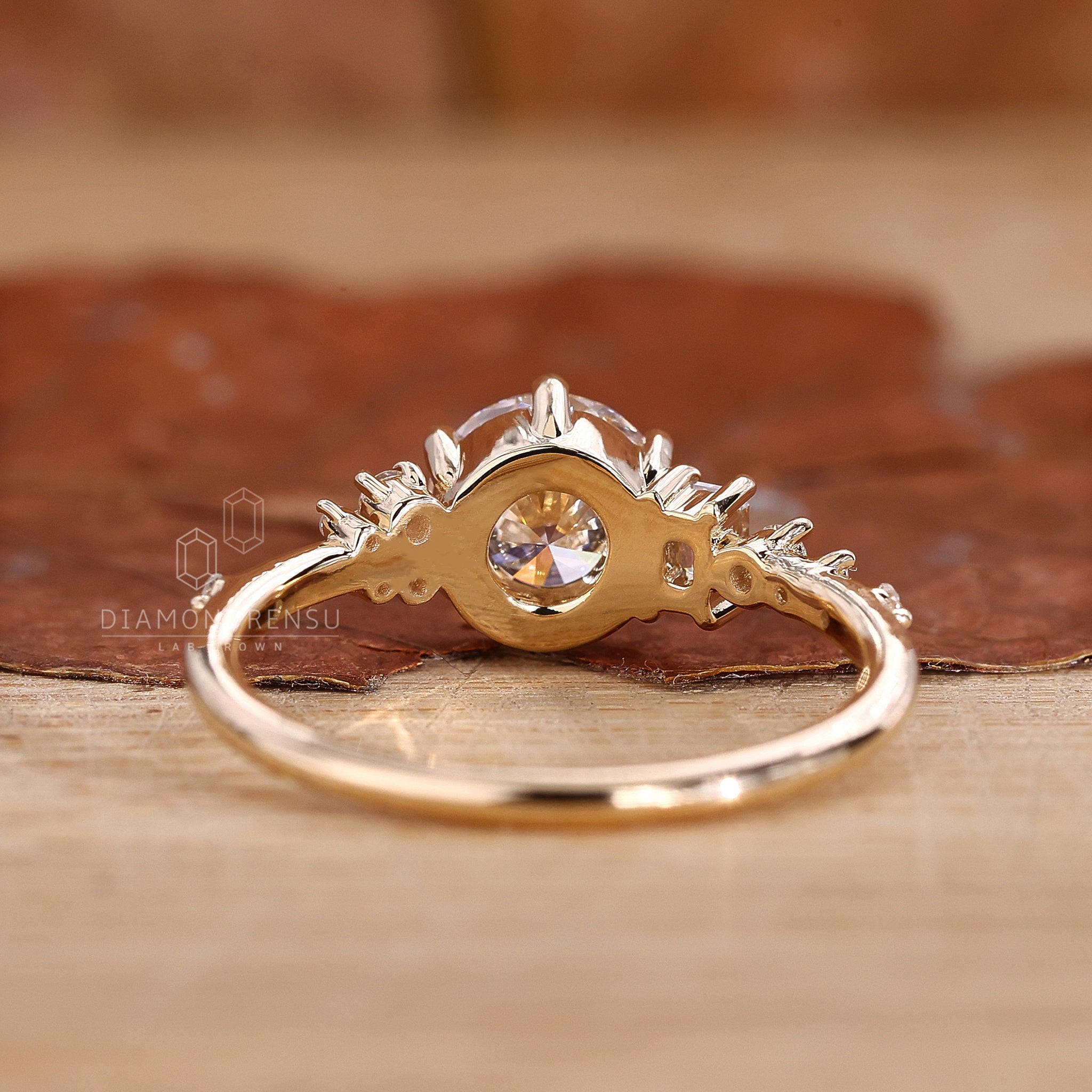 Yellow gold ring with round cut engagement ring detail
