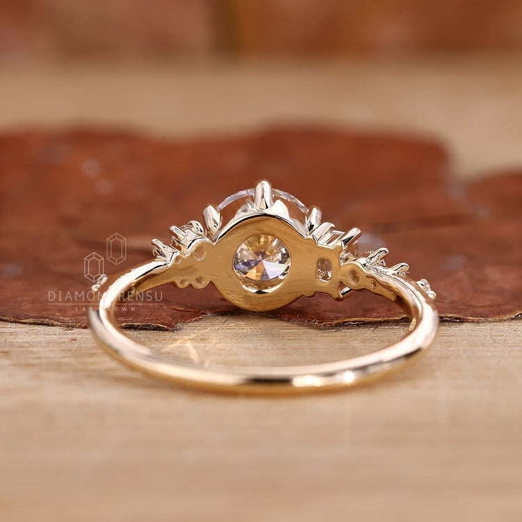 Yellow gold ring with round cut engagement ring detail
