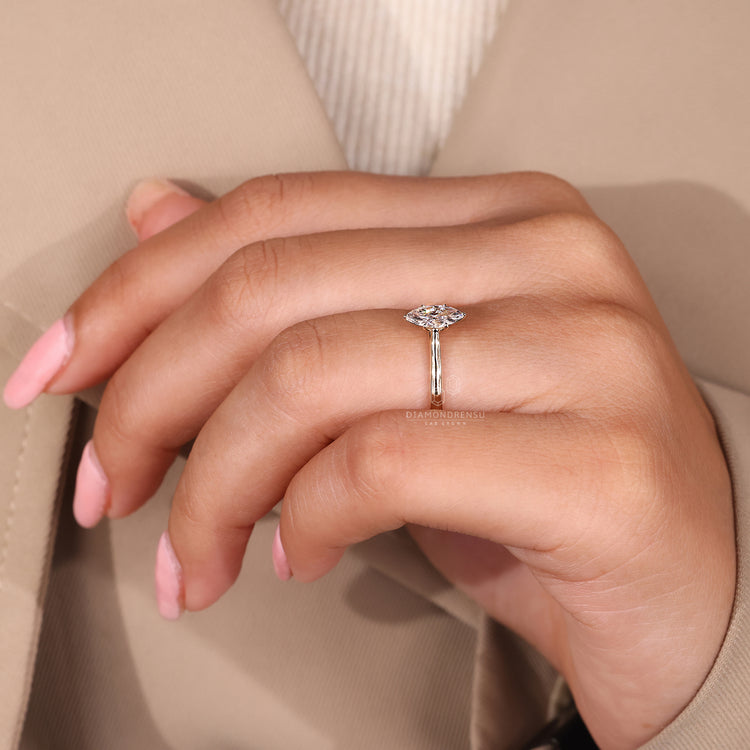 Lab Grown Diamond marquise ring in a gold setting.
