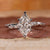 Dutch marquise diamond ring with marquise and round side stone.
