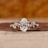 Halo Oval Ring Engagement with yellow gold ring
