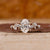Halo Oval Ring Engagement with yellow gold ring
