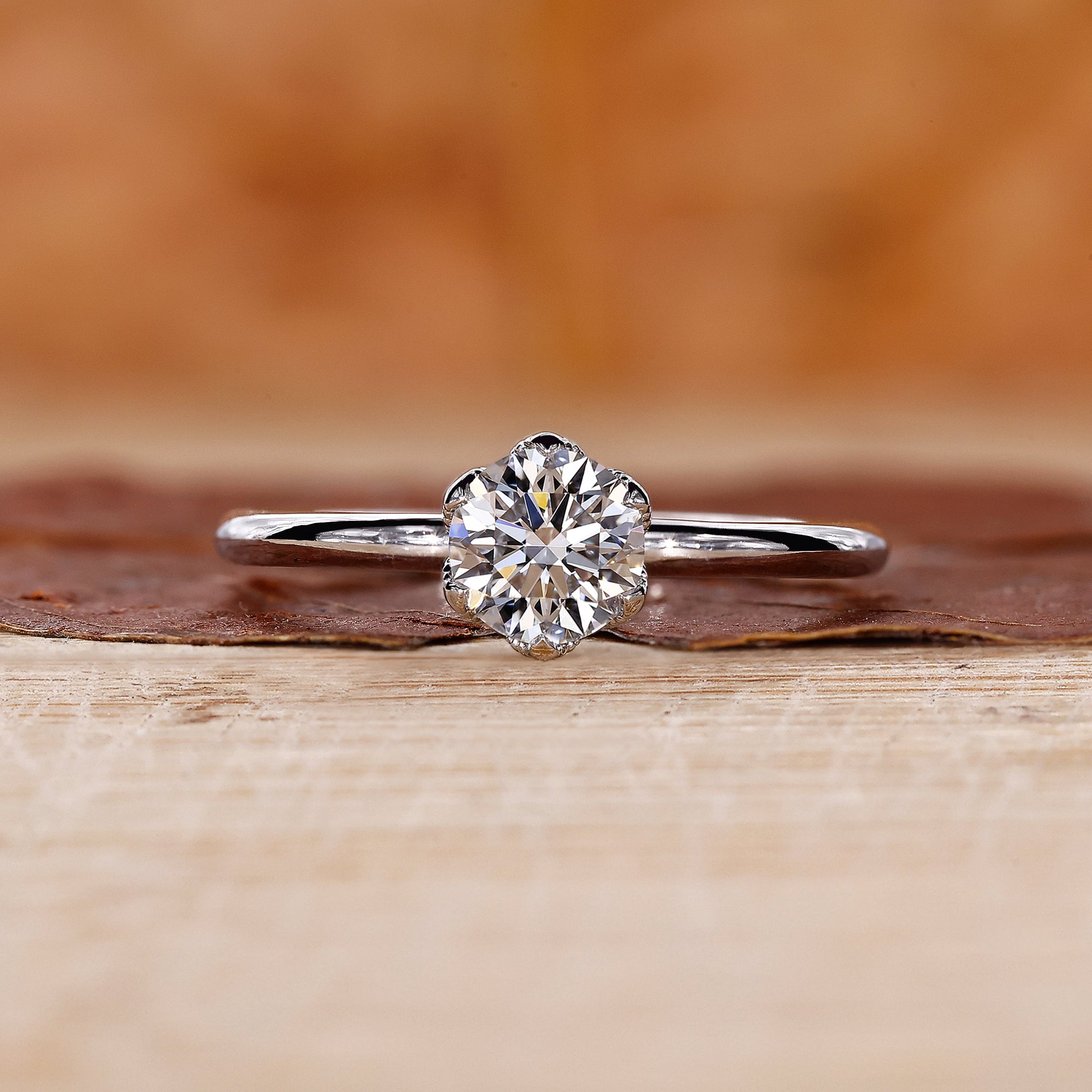 Solitaire engagement ring with nature inspired ring design.
