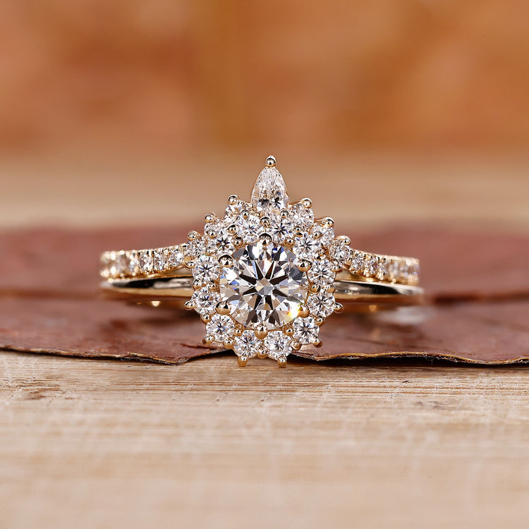 Curved wedding band paired with round engagement ring in yellow gold.
