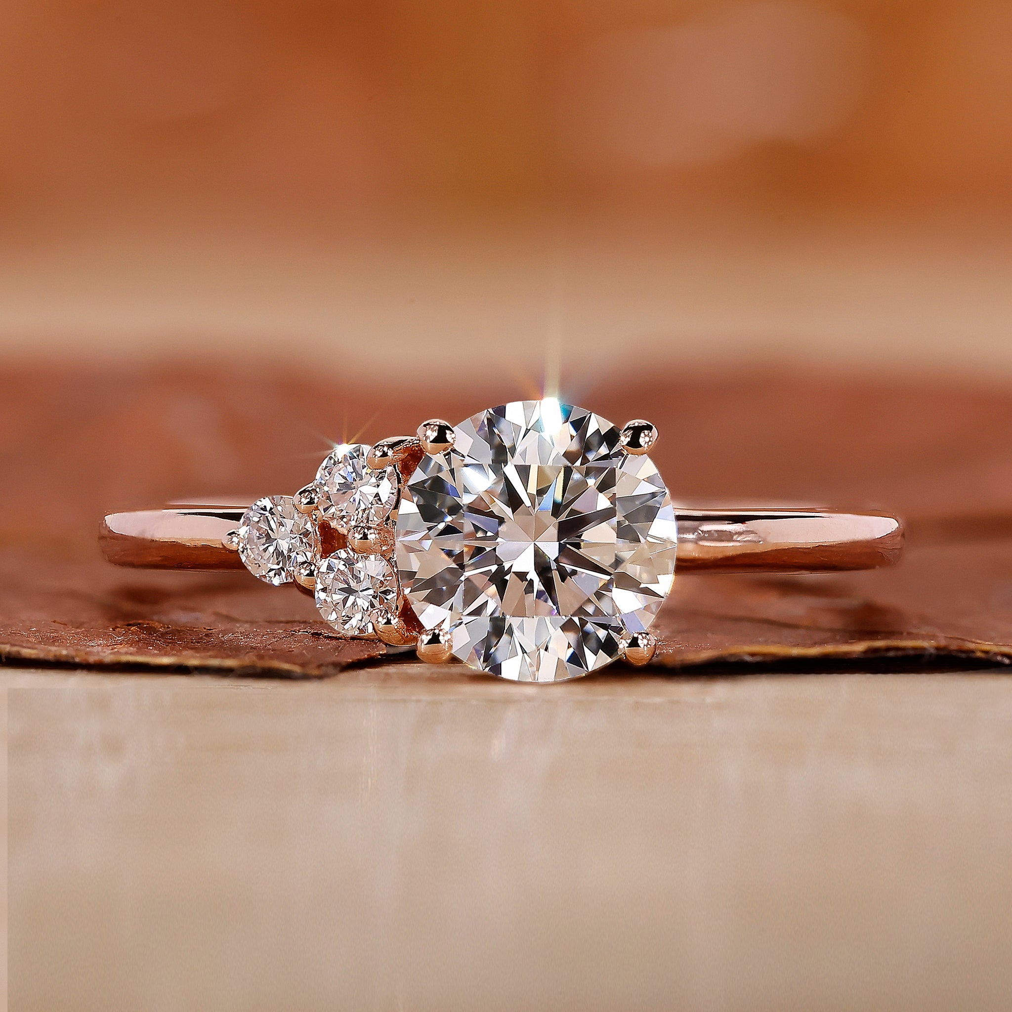 Asymmetrical Engagement Ring with round brilliant cut diamond.
