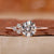 Asymmetrical Engagement Ring with round brilliant cut diamond.

